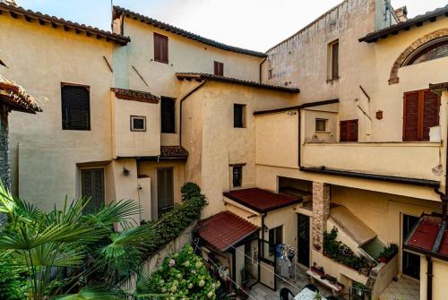 a group of buildings in a city with plants at Artist's Suites in Spoleto