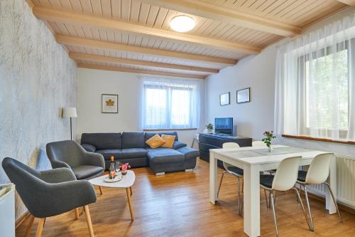 a living room with a couch and a table at Villa Gap apartments in Český Krumlov