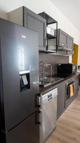 Η κουζίνα ή μικρή κουζίνα στο Les Appartements de la Nef d'Or