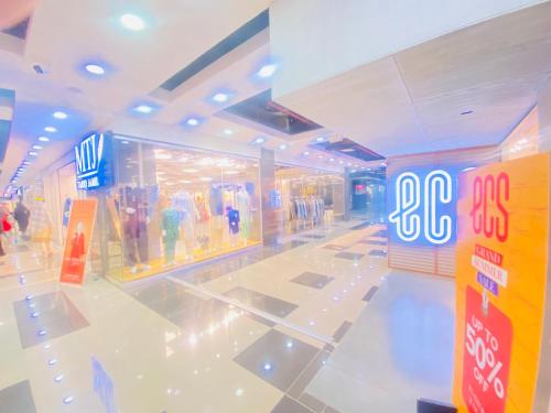 a shopping mall with a big sign in the middle at Three Bed Premium Apartment in Islamabad