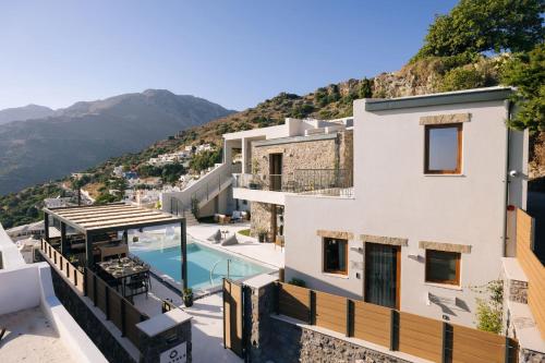 a view of a house with a swimming pool at Mirthea Suites in Mírthios