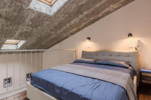 Ένα ή περισσότερα κρεβάτια σε δωμάτιο στο San Bartolomeo loft guest house