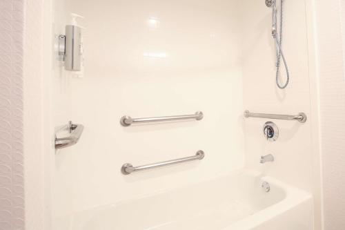 a bathroom with a shower and a sink at Hampton Inn Bordentown in Bordentown