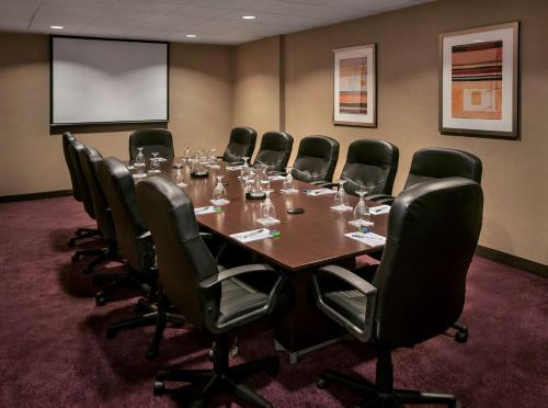 a conference room with a long table and chairs at Hampton Inn & Suites Milwaukee Downtown in Milwaukee
