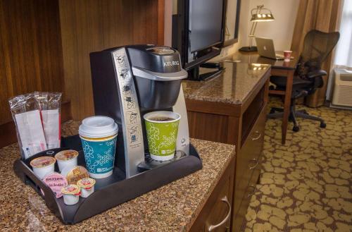 a coffee maker on a counter in a hotel room at Hilton Garden Inn Laramie in Laramie