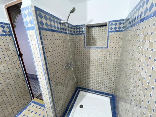 a bathroom with a shower with a toilet in it at Dar Sunrise Fes in Fès