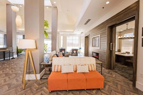 a living room with a bed and a couch at Hilton Garden Inn Temple Medical Center in Temple