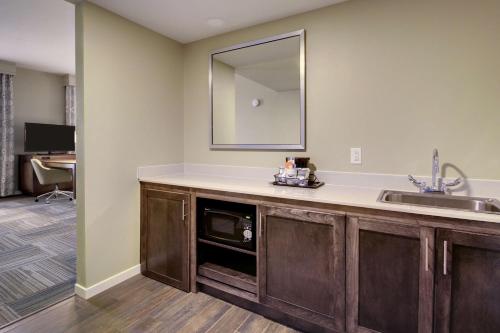a bathroom with a sink and a mirror at Hampton Inn & Suites Cordele in Cordele