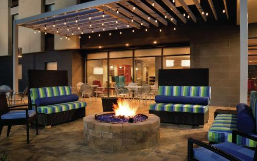 a lobby with two chairs and a fire pit at Home2 Suites By Hilton Macon I-75 North in Macon
