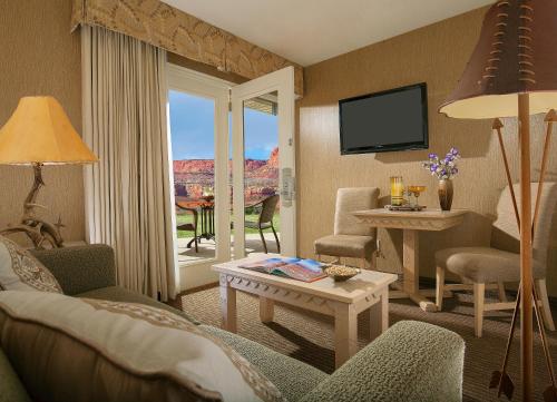 a living room with a view of the grand canyon at Capitol Reef Resort in Torrey