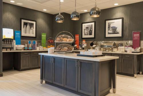 a store with a counter in the middle of a room at Hampton Inn & Suites Indianapolis-Keystone, IN in Indianapolis