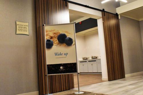 a sign that says wake up in a room at Doubletree By Hilton Helena Downtown in Helena