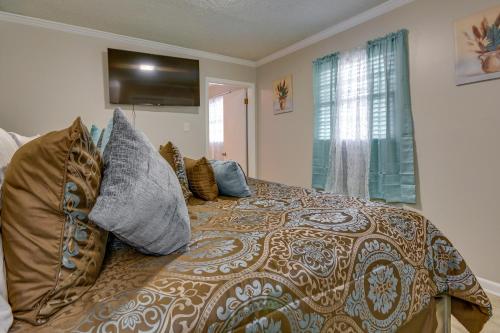 a bedroom with a bed with pillows on it at Spacious Little Rock Home with Patio - 9 Mi to Dtwn! in Little Rock
