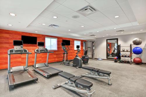 a gym with several treadmills and exercise machines at Home2 Suites By Hilton Beaufort in Beaufort