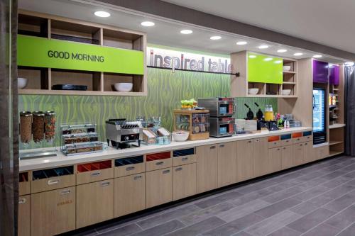 a grocery store with a counter in a store at Home2 Suites By Hilton Salisbury in Salisbury
