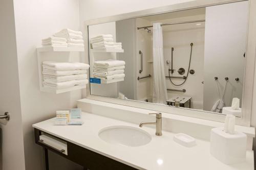 a bathroom with a sink and a mirror at Hampton Inn & Suites Lenoir, NC in Lenoir