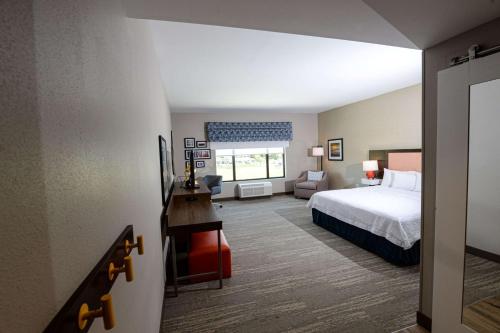 a hotel room with a bed and a desk at Hampton Inn & Suites Lenoir, NC in Lenoir
