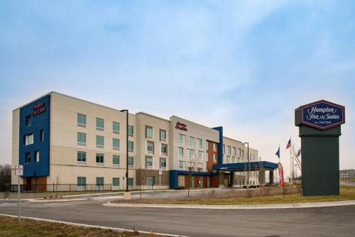 a hotel building with a sign in front of it at Hampton Inn & Suites Adrian, Mi in Adrian