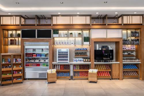 a store filled with lots of food and drinks at Hilton Garden Inn Kuwait in Kuwait
