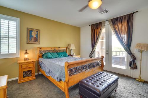 a bedroom with a wooden bed and a window at Serene Las Vegas Home with Heated Pool Near Strip! in Las Vegas