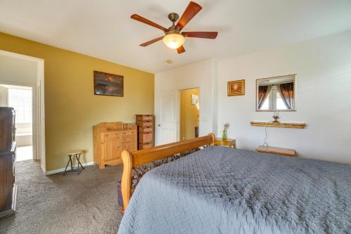 a bedroom with a bed and a ceiling fan at Serene Las Vegas Home with Heated Pool Near Strip! in Las Vegas