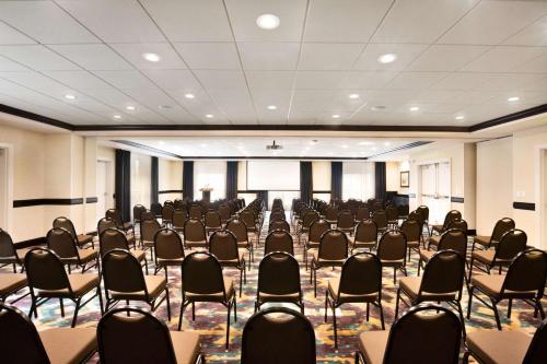 a large room with chairs and tables in it at DoubleTree by Hilton Charleston Mount Pleasant in Charleston