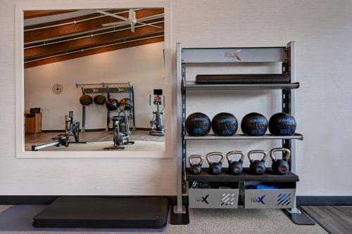a room with a gym with a bunch of equipment at Homewood Suites By Hilton Eagle Boise, Id in Eagle