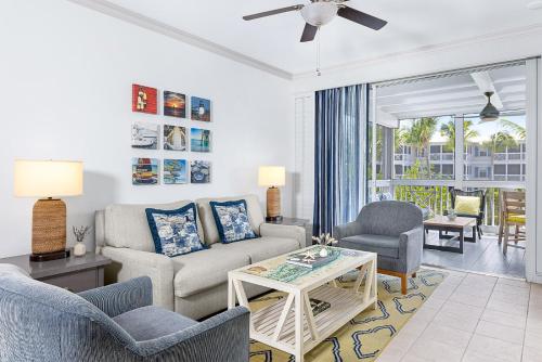 a living room with a couch and chairs and a table at Hyatt Vacation Club at Beach House in Key West