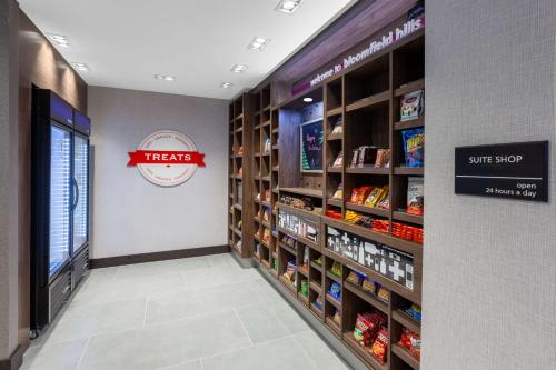 a store aisle with a smile stop sign and shelves of food at Hampton Inn & Suites Bloomfield Hills Detroit in Bloomfield Hills