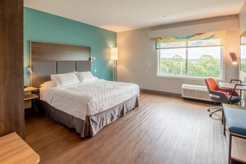a hotel room with a bed and a window at Tru By Hilton Niceville, Fl in Niceville
