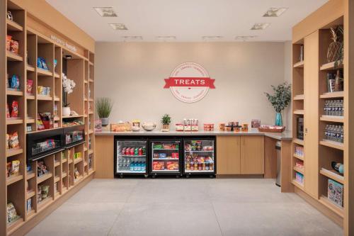 a pharmacy aisle with aries sign in a store at Hampton Inn & Suites Huntsville Downtown, Al in Huntsville