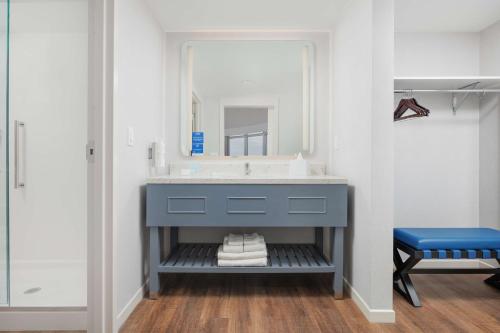 a bathroom with a sink and a mirror at Hampton Inn & Suites Huntsville Downtown, Al in Huntsville
