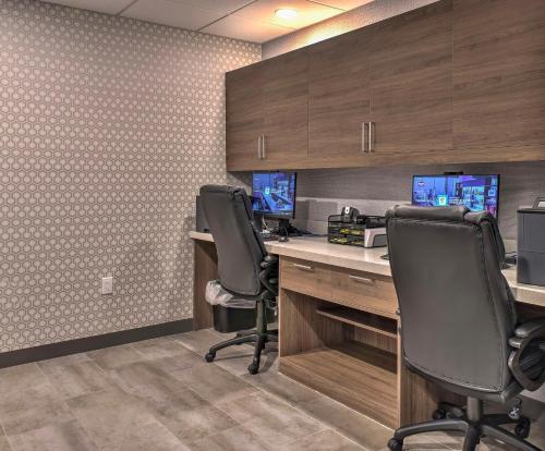 an office with two desks with chairs and a computer at Hampton Inn & Suites Keene in Keene