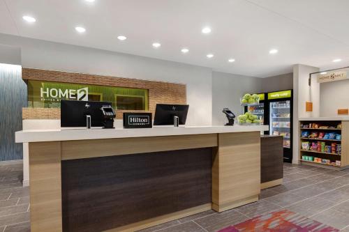 a lobby of a store with a honoluluoluluoluluoluluoluluoluluoluluolulu at Home2 Suites By Hilton Wilkes-Barre in Wilkes-Barre