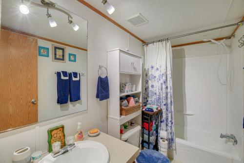 a bathroom with a sink and a shower at Creekfront Max Meadows Mobile Home with Deck! in Max Meadows