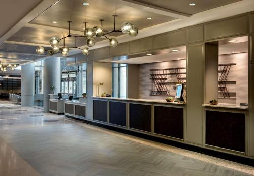 a lobby with a waiting area in a building at Embassy Suites by Hilton Bethesda Washington DC in Bethesda