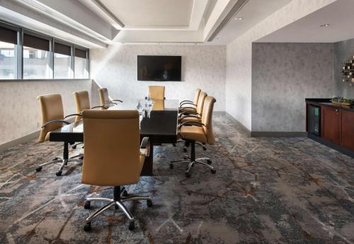 a conference room with a table and chairs at Embassy Suites by Hilton Bethesda Washington DC in Bethesda