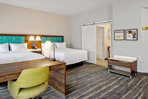 a hotel room with two beds and a desk at Hampton Inn & Suites Cincinnati West, Oh in Dent