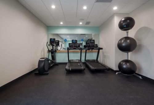 a room with a gym with cardio equipment and balloons at Tru By Hilton Novi Detroit in Novi