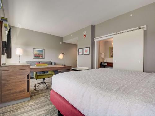 a hotel room with a bed and a desk at Hampton Inn & Suites Williamstown Ark Encounter, Ky in Williamstown