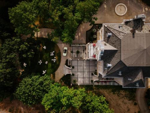 an overhead view of a house with a roof at Willa Berlińska - pokoje ,restauracja in Kościan