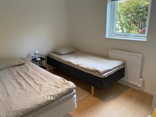 Postel nebo postele na pokoji v ubytování Hus nära havet i Olofsbo