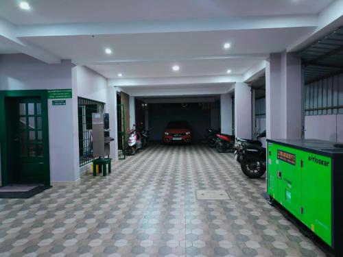 a garage with a car parked inside of it at Alohaa Homestel in Coimbatore