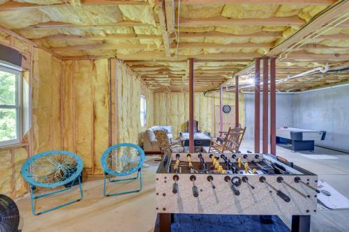 a room with a table and chairs in it at Lakemont Retreat Game Room, Hot Tub, and Mtn Views! in Lakemont
