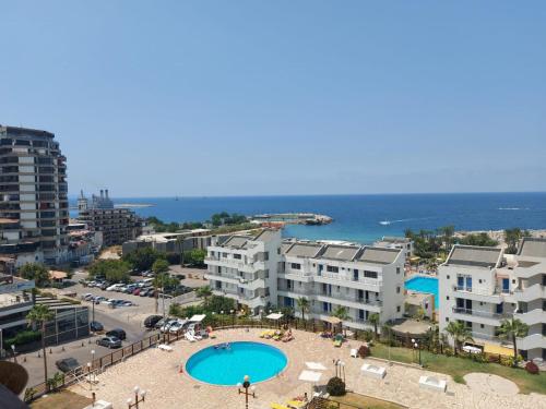 a view of a city with a swimming pool and buildings at Chalet in Solemar,renovated,parking,Wifi elec247 in Jounieh