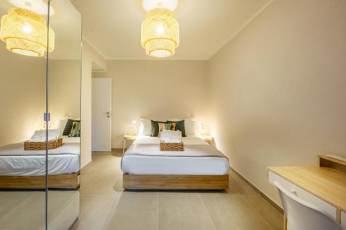 a bedroom with two beds and a glass wall at A casa di Giuly in Florence