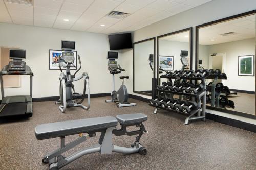 a gym with several tread machines and mirrors at Candlewood Suites - Lebanon by IHG in Lebanon
