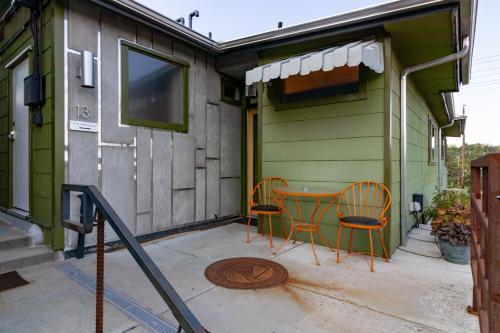 a patio with two chairs and a table on a house at The Motor Lodge in Prescott