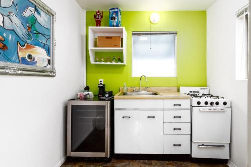 a kitchen with a sink and a stove at The Motor Lodge in Prescott
