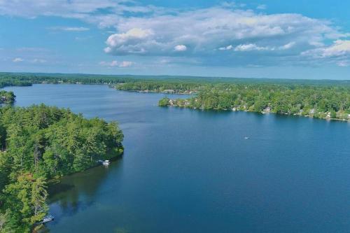 an aerial view of a large river with trees at Canobie Lake 3bedroom waterfront in Windham